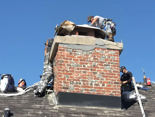 Suffield Chimney Sweep installing a custom chimney crown in Suffield, CT