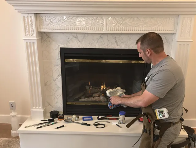 Suffield Chimney Sweep performing fireplace maintenance in Suffield, CT