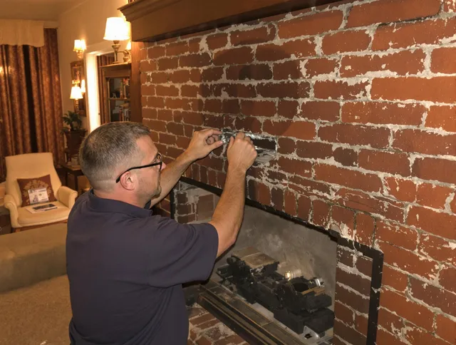 Suffield Chimney Sweep expert fixing a fireplace in Suffield, CT